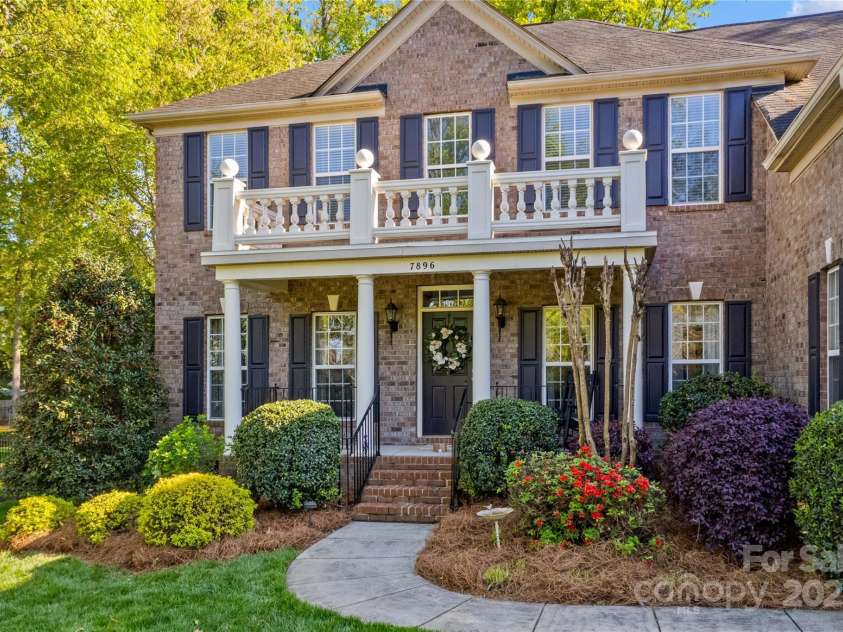 7896 Harbor Master Court, Denver, NC 28037.  MLS# CAR4251576, YatesRealty ID 10840. Covered front porch is ideal for rocking chairs to enjoy the Carolina weather.
