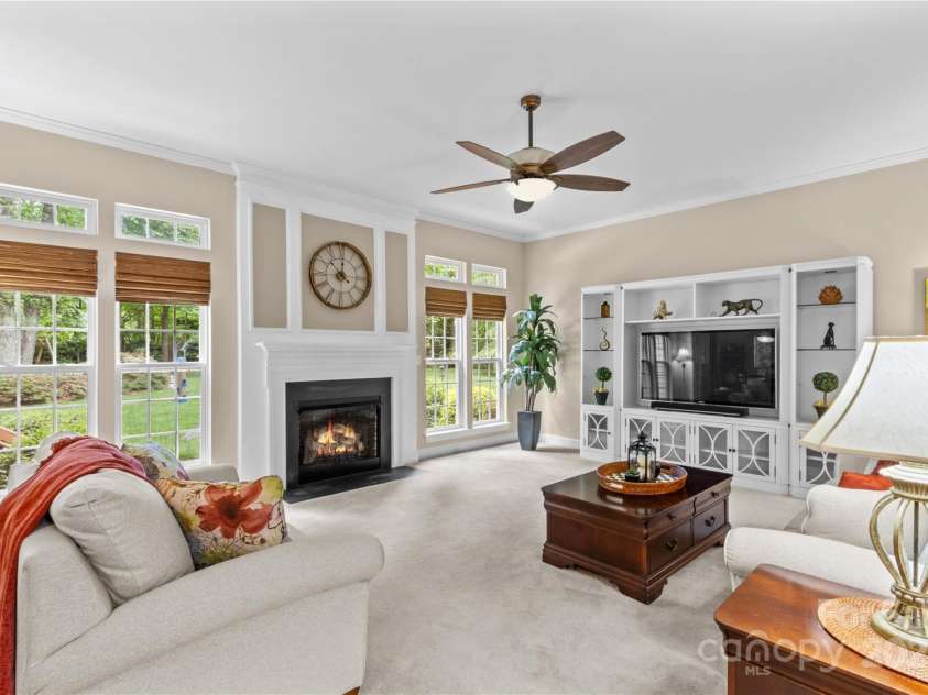 7896 Harbor Master Court, Denver, NC 28037.  MLS# CAR4251576, YatesRealty ID 10840. Family room is centered around gas fireplace and overlooks park-like backyard.
