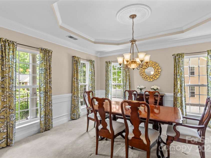7896 Harbor Master Court, Denver, NC 28037.  MLS# CAR4251576, YatesRealty ID 10840. Formal dining room with wainscoating, crown molding, and lots of windows letting in natural light.