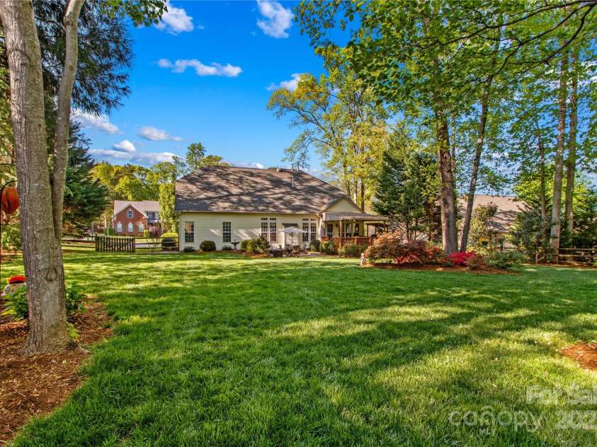 7896 Harbor Master Court, Denver, NC 28037.  MLS# CAR4251576, YatesRealty ID 10840. Large flat backyard has been meticulously manicured.
