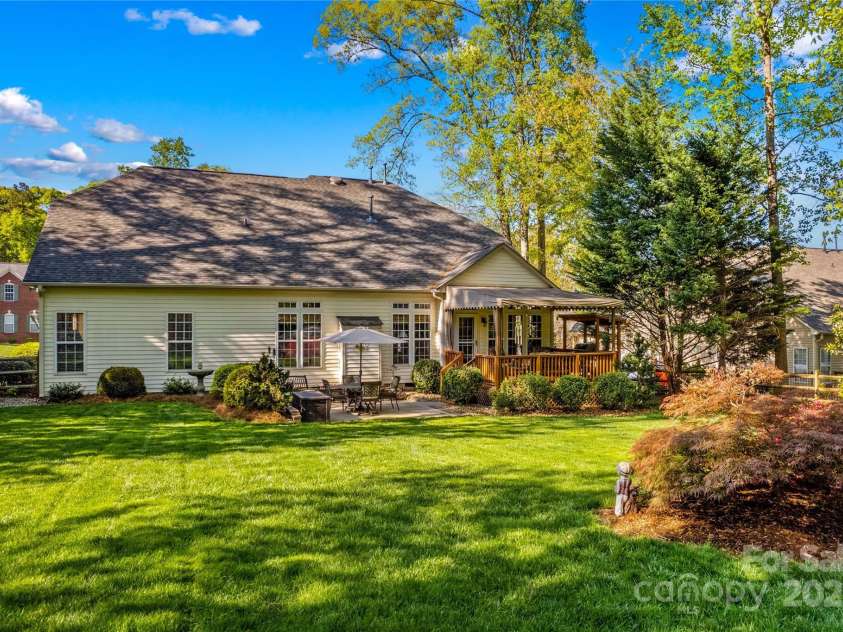 7896 Harbor Master Court, Denver, NC 28037.  MLS# CAR4251576, YatesRealty ID 10840. The back of this home includes a covered deck with brand new awning and open patio.