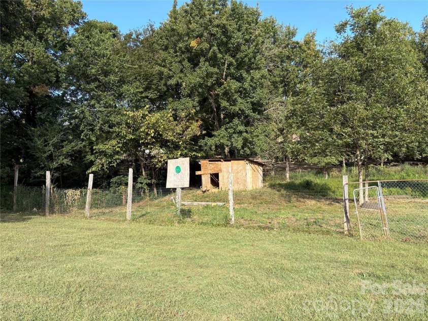 3014 Morgan Mill Road, Monroe, NC 28110.  MLS# CAR4368018, YatesRealty ID 10841. Backyard extends behind fence