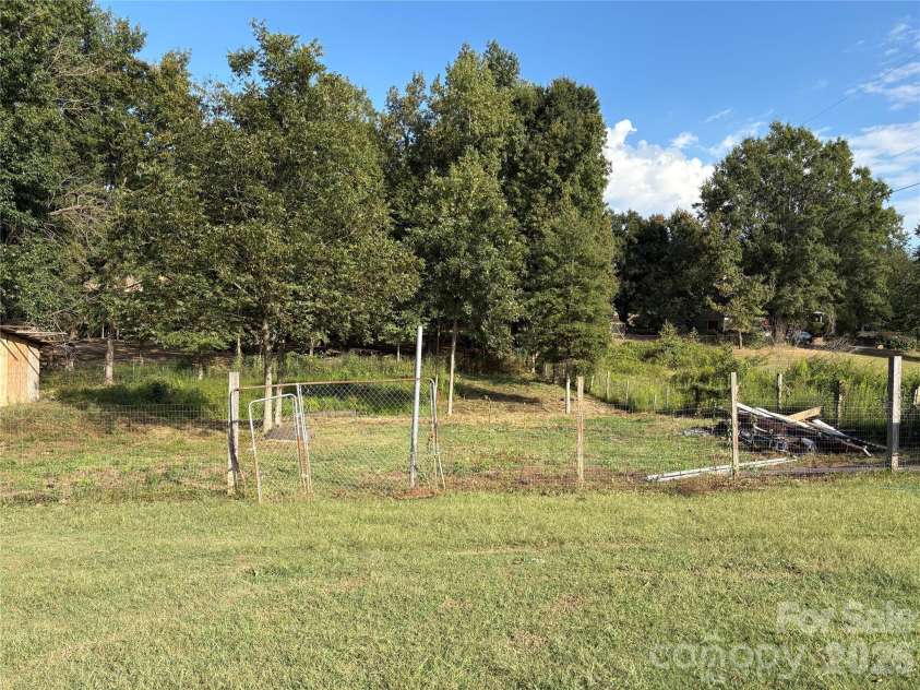 3014 Morgan Mill Road, Monroe, NC 28110.  MLS# CAR4368018, YatesRealty ID 10841. Backyard extends behind fence