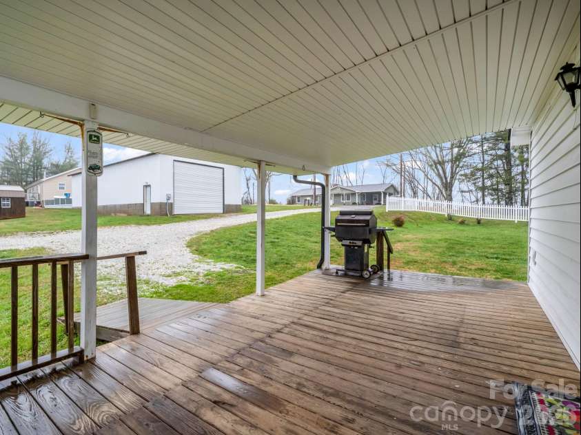 1086 Carters Ridge Road, Spruce Pine, NC 28777.  MLS# CAR4406527, YatesRealty ID 10853. Side Covered Porch