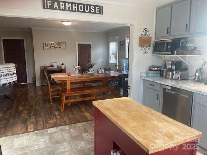 3513 Gilboa Road, Marshville, NC 28103.  MLS# CAR4283541, YatesRealty ID 10862. Kitchen into dining area