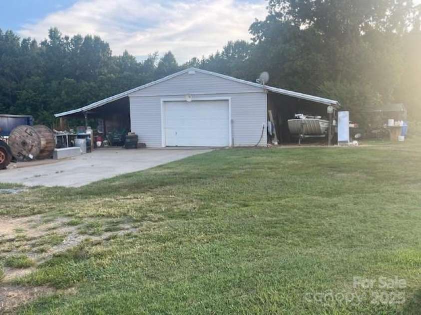 3513 Gilboa Road, Marshville, NC 28103.  MLS# CAR4283541, YatesRealty ID 10862. Workshop with outside storage.  Enclosed portion is 50 X 24.  Additionally has shed on both sides.