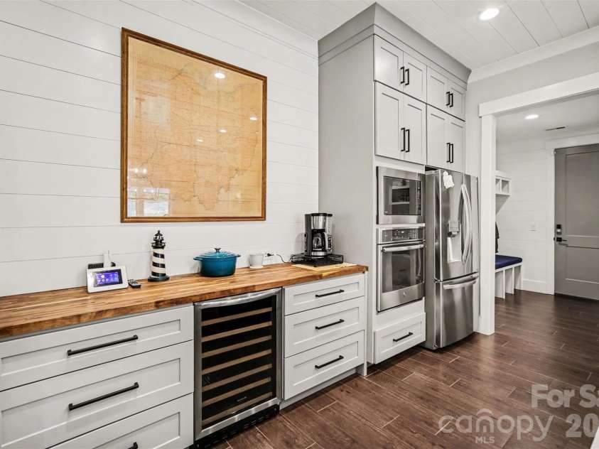 4317 Steepleton Way, Charlotte, NC 28215.  MLS# CAR4363516, YatesRealty ID 10864. Bar area with beverage refrigerator 