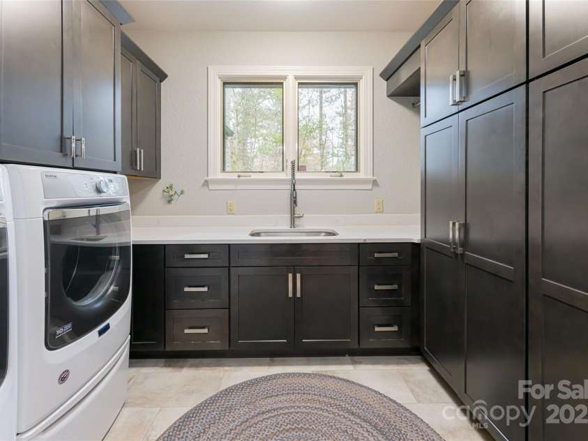 212 Shadybrook Trail, Hendersonville, NC 28739.  MLS# CAR4240276, YatesRealty ID 10878. Laundry and pantry