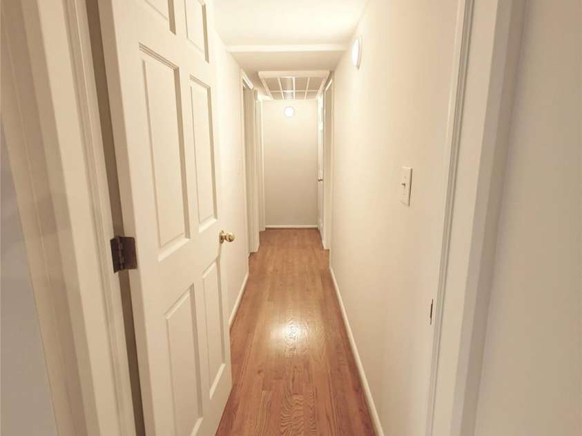 1323 Queens Road, Charlotte, NC 28207.  MLS# CAR4323169, YatesRealty ID 1088. Hall toward Bedrooms has a door.