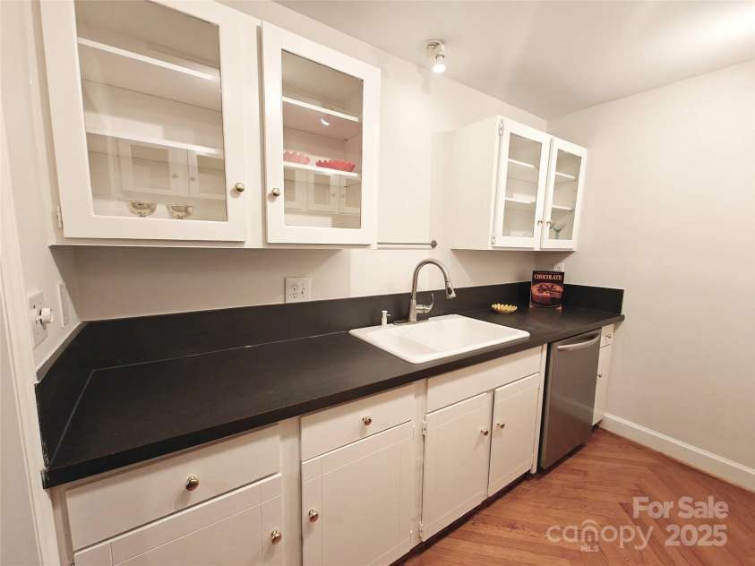 1323 Queens Road, Charlotte, NC 28207.  MLS# CAR4323169, YatesRealty ID 1088. Porcelain one and a half bowl Sink with disposal & soap dispenser