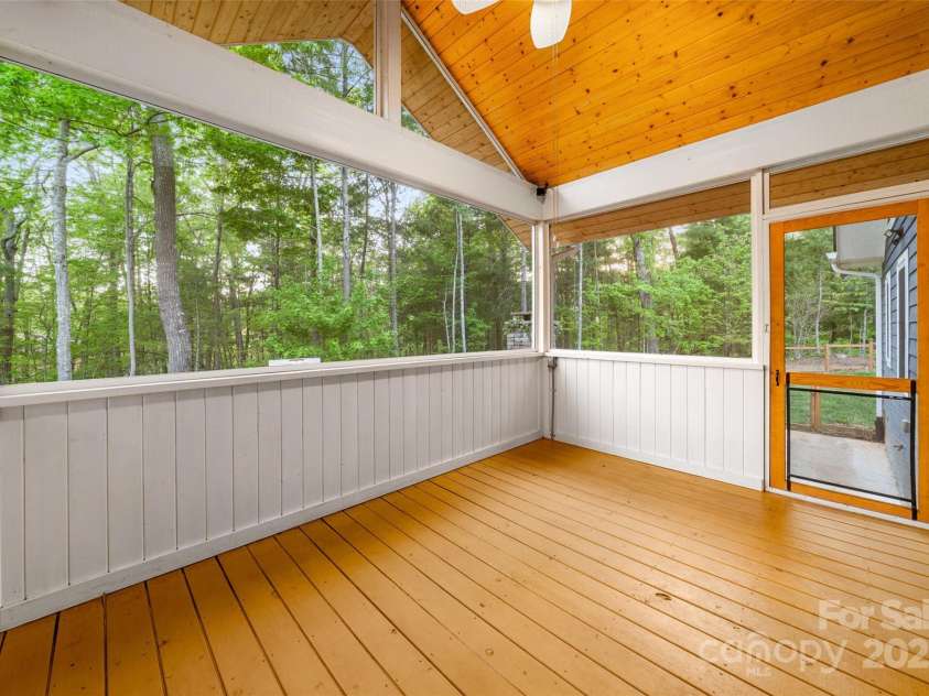 8 Clover Ridge Lane, Leicester, NC 28748.  MLS# CAR4247209, YatesRealty ID 10885. Fullly screened back porch