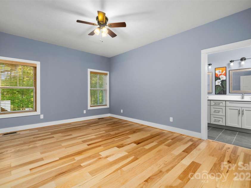 8 Clover Ridge Lane, Leicester, NC 28748.  MLS# CAR4247209, YatesRealty ID 10885. Relax in your primary bedroom