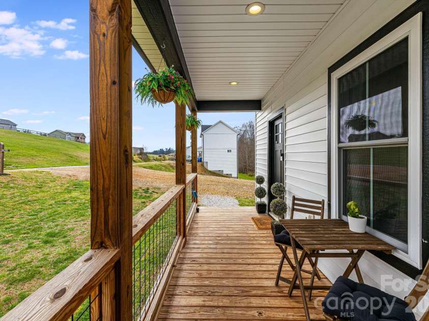 842 Old NC 20 Highway, Alexander, NC 28701.  MLS# CAR4353364, YatesRealty ID 10892. Covered Front Porch/Sitting area