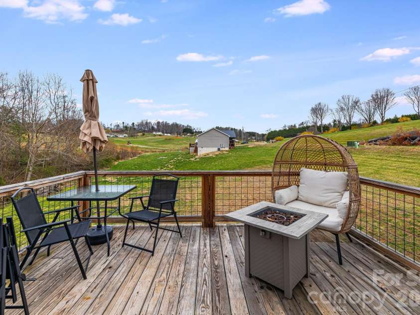 842 Old NC 20 Highway, Alexander, NC 28701.  MLS# CAR4353364, YatesRealty ID 10892. Side deck off dining/kitchen