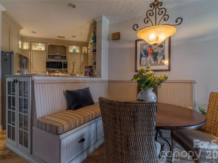 1113 Torrence Circle, Davidson, NC 28036.  MLS# CAR4337531, YatesRealty ID 10902. Built-in dining room Banquet with storage and seating.