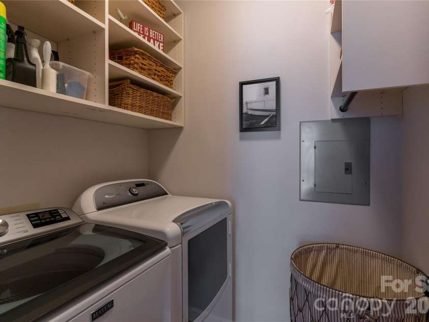 1113 Torrence Circle, Davidson, NC 28036.  MLS# CAR4337531, YatesRealty ID 10902. California custom shelving in laundry room.