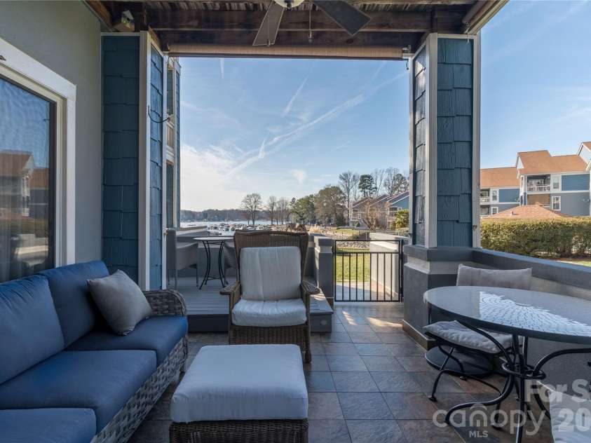 1113 Torrence Circle, Davidson, NC 28036.  MLS# CAR4337531, YatesRealty ID 10902. Covered patio with custom slate tile.