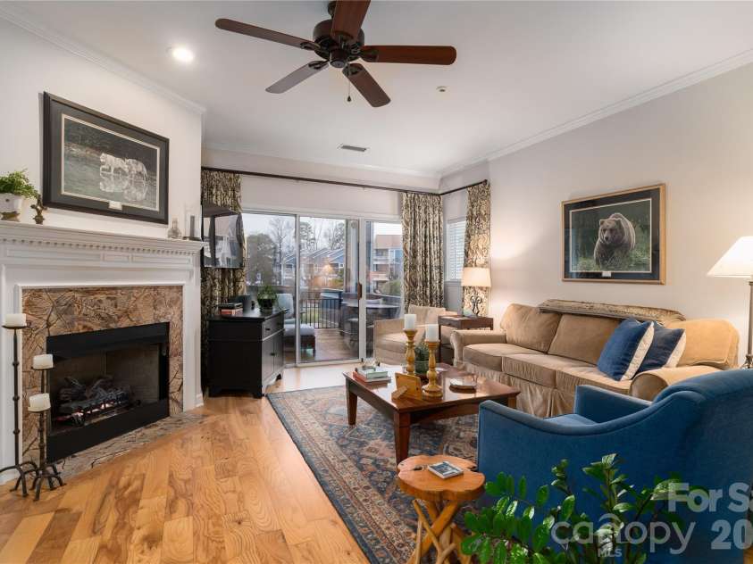 1113 Torrence Circle, Davidson, NC 28036.  MLS# CAR4337531, YatesRealty ID 10902. Gas fireplace with marble surround.