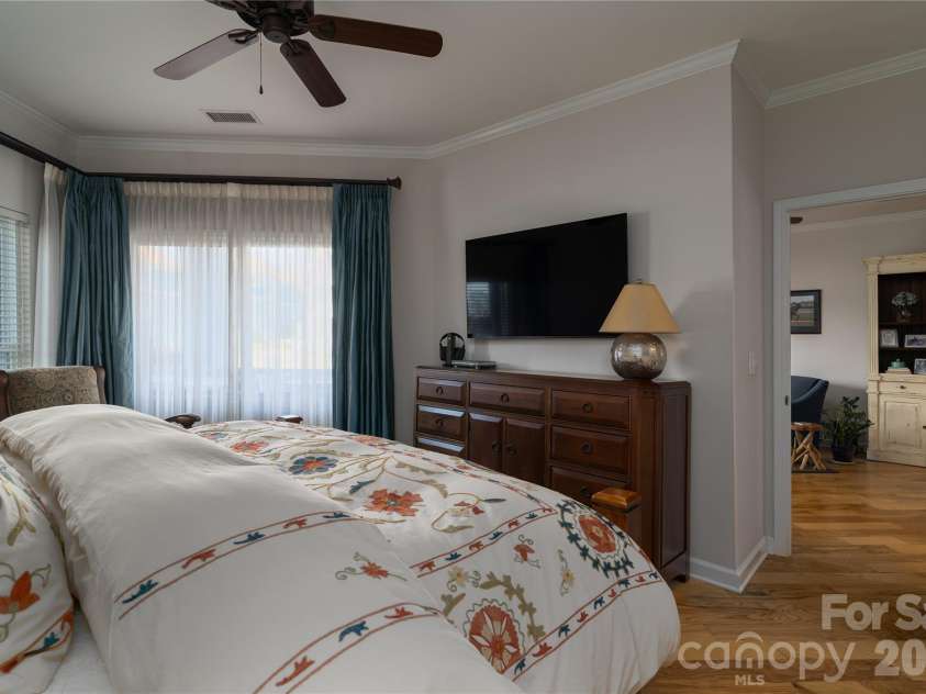 1113 Torrence Circle, Davidson, NC 28036.  MLS# CAR4337531, YatesRealty ID 10902. Hardwoods continue into primary suite.