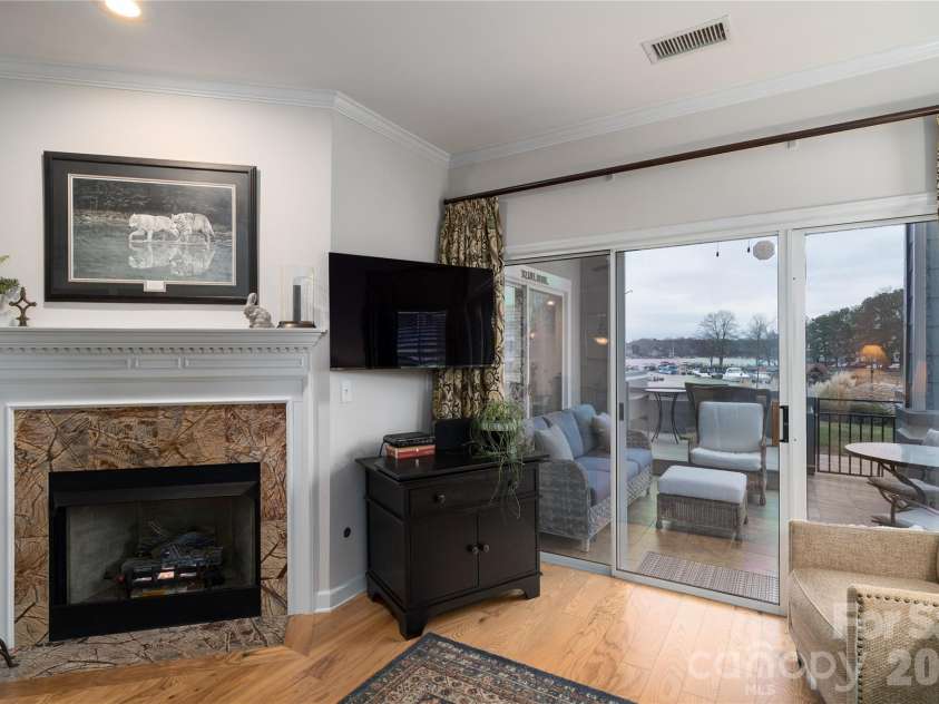 1113 Torrence Circle, Davidson, NC 28036.  MLS# CAR4337531, YatesRealty ID 10902. Hidden wire chase for all televisions.