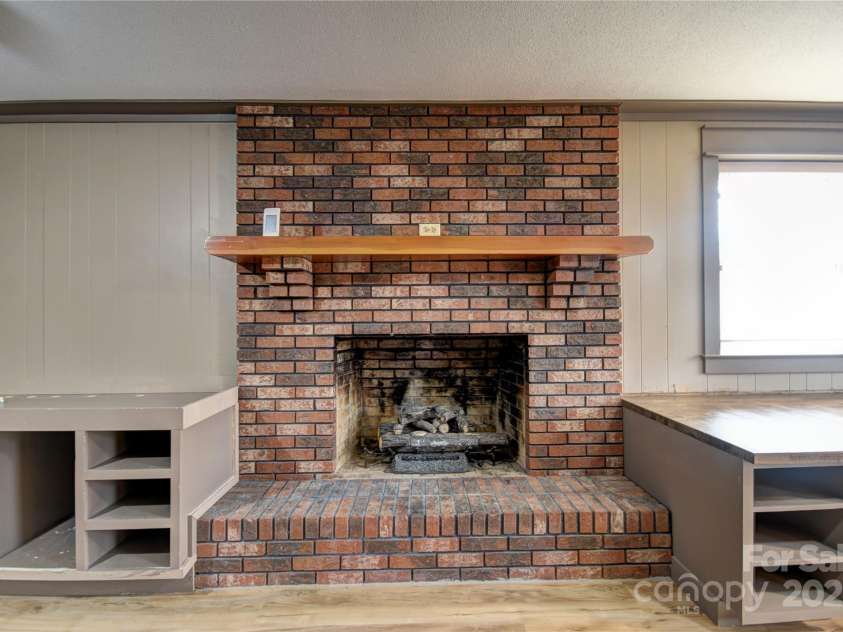 119 Pleasant Hill Circle, Waynesville, NC 28786.  MLS# CAR4325217, YatesRealty ID 1091. Gas Log Fireplace in the lower level den