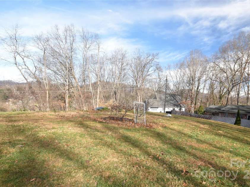 119 Pleasant Hill Circle, Waynesville, NC 28786.  MLS# CAR4325217, YatesRealty ID 1091. Mountain views from the backyard