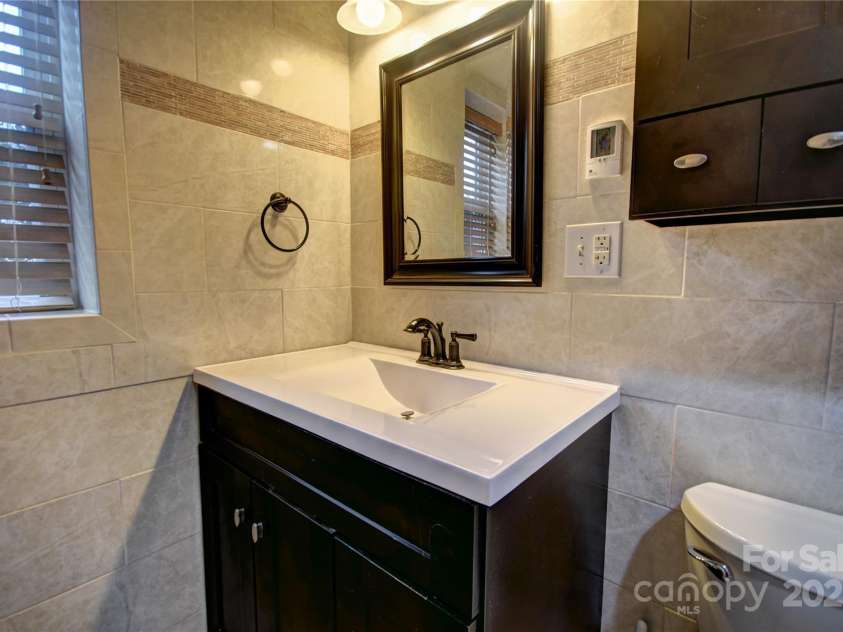 119 Pleasant Hill Circle, Waynesville, NC 28786.  MLS# CAR4325217, YatesRealty ID 1091. Updated Primary Bathroom lower level