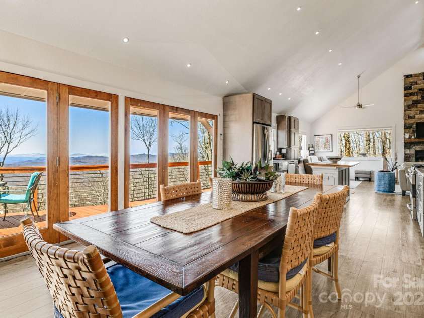 129 Finney Lane, Mars Hill, NC 28754.  MLS# CAR4243744, YatesRealty ID 10915. Dining area overlooking the mountains leading out onto the deck.