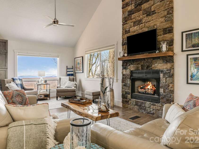 129 Finney Lane, Mars Hill, NC 28754.  MLS# CAR4243744, YatesRealty ID 10915. Living room with gas log fireplace.
