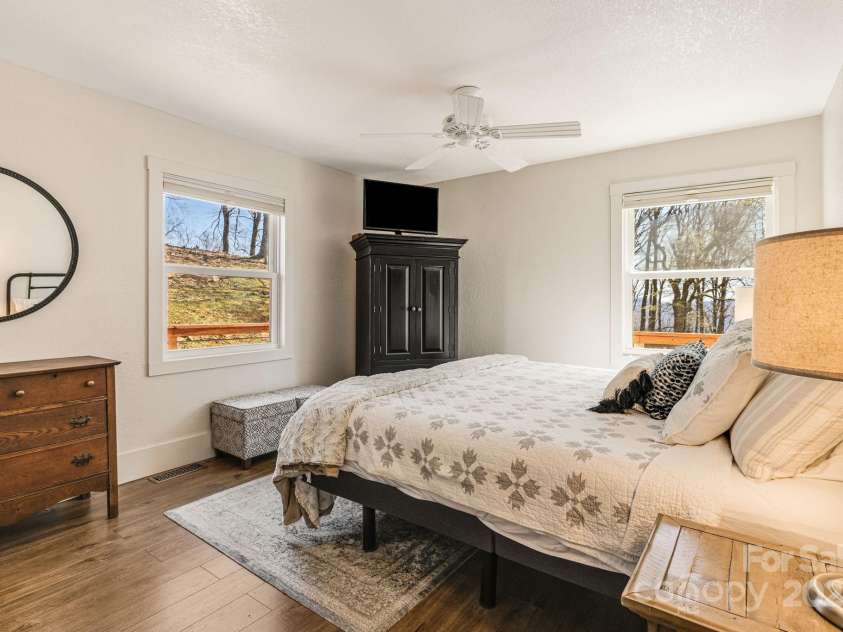 129 Finney Lane, Mars Hill, NC 28754.  MLS# CAR4243744, YatesRealty ID 10915. Main level primary suite with sunrise views.