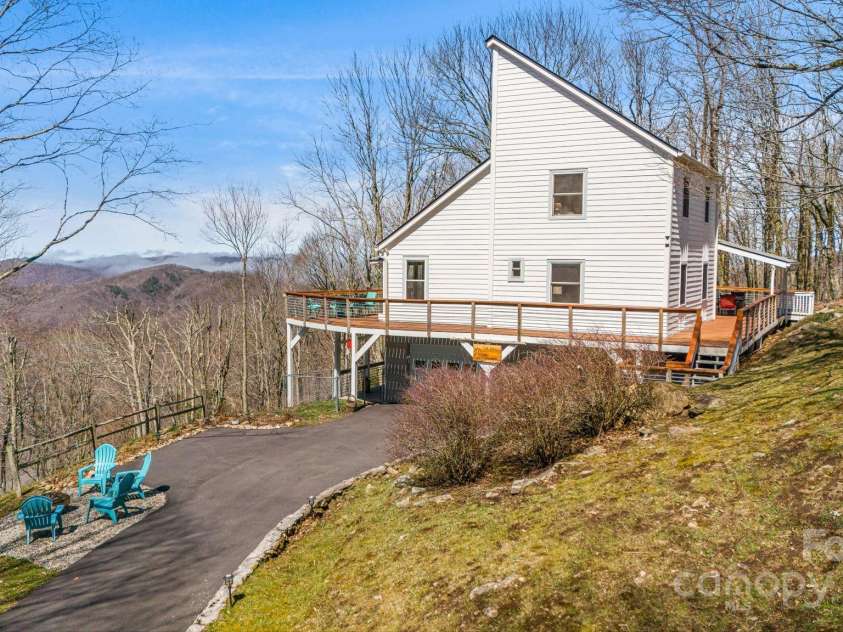 129 Finney Lane, Mars Hill, NC 28754.  MLS# CAR4243744, YatesRealty ID 10915. Outdoor fire pit, fenced side yard & separate entrance to the lower level.