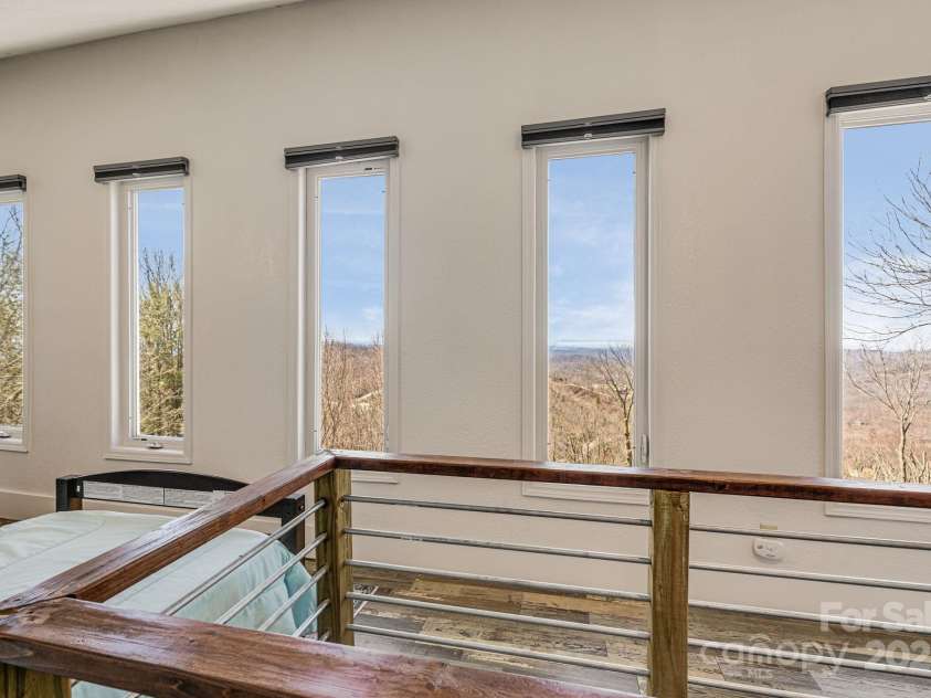 129 Finney Lane, Mars Hill, NC 28754.  MLS# CAR4243744, YatesRealty ID 10915. Some of the best views in the house can be found in the loft/secret attic.
