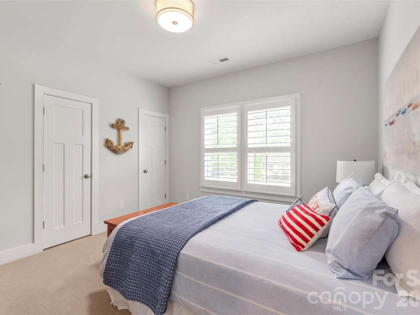3437 Draper Avenue, Charlotte, NC 28205.  MLS# CAR4364902, YatesRealty ID 10915. Charming front-facing bedroom complete with elegant plantation shutters, designer lighting, upgraded carpet, and two closets.