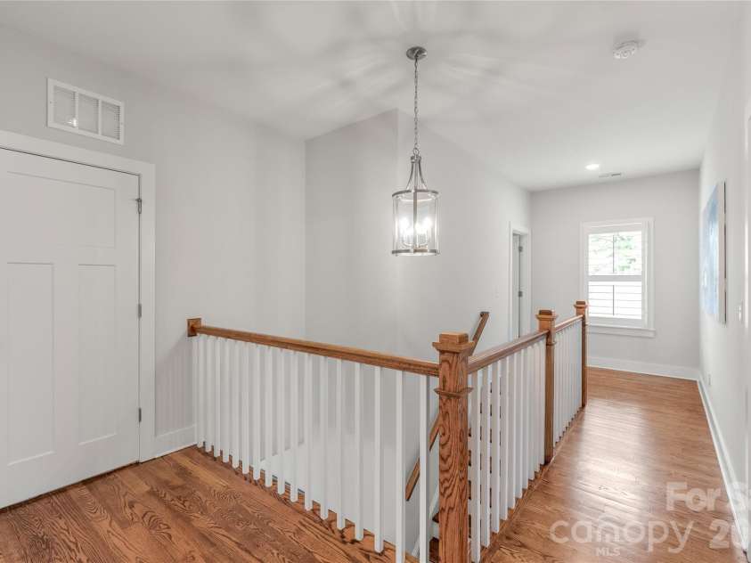 3437 Draper Avenue, Charlotte, NC 28205.  MLS# CAR4364902, YatesRealty ID 10915. Laundry day made easy. This spacious second-floor walk-in laundry room is perfectly positioned across from the primary suite for maximum convenience.
