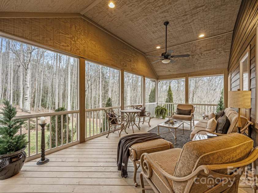 43 Smokemont Drive, Arden, NC 28704.  MLS# CAR4197497, YatesRealty ID 10921. A wonderful addition in 2009 is this grand screened porch.