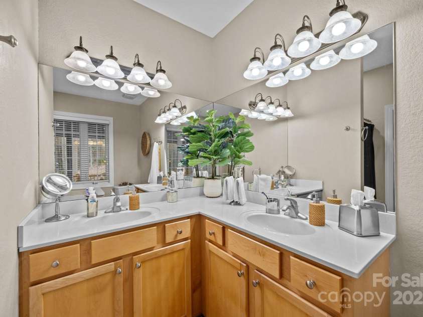 43 Smokemont Drive, Arden, NC 28704.  MLS# CAR4197497, YatesRealty ID 10921. Another view of the double primary bath vanities.