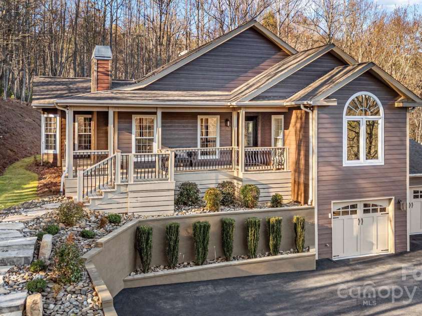 43 Smokemont Drive, Arden, NC 28704.  MLS# CAR4197497, YatesRealty ID 10921. Beautiful, natural rock steps from the driveway to the front deck.