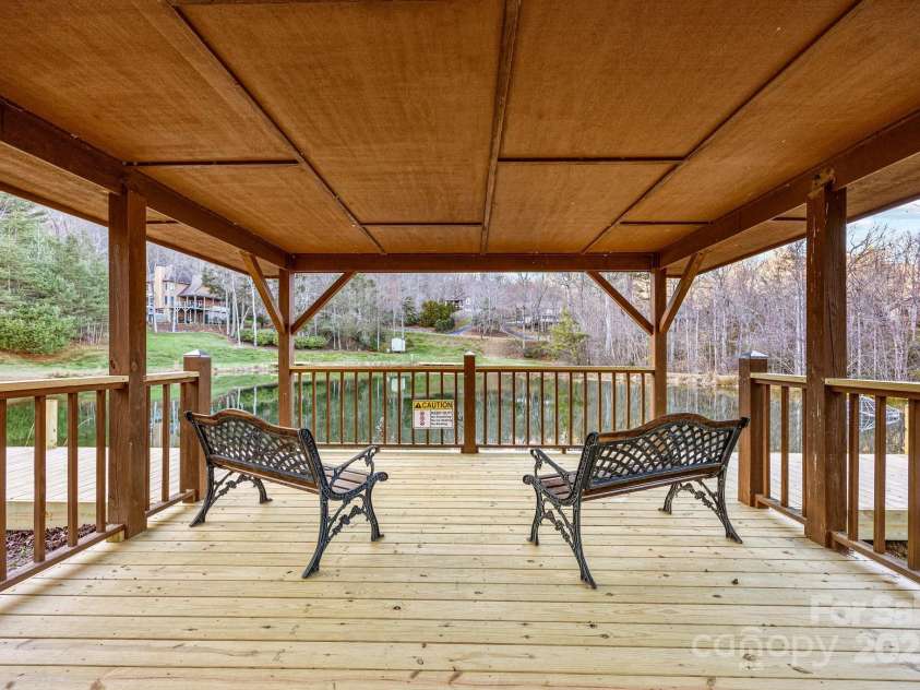 43 Smokemont Drive, Arden, NC 28704.  MLS# CAR4197497, YatesRealty ID 10921. Deck of the trout pond.