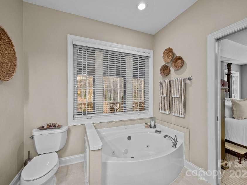 43 Smokemont Drive, Arden, NC 28704.  MLS# CAR4197497, YatesRealty ID 10921. Jetted tub with private views of the property.