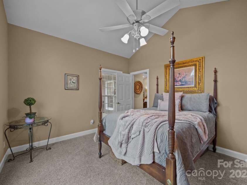 43 Smokemont Drive, Arden, NC 28704.  MLS# CAR4197497, YatesRealty ID 10921. Main level secondary bedroom with neutral carpet.  Bed here is a queen size.