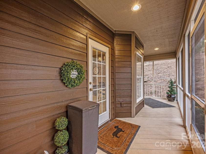 43 Smokemont Drive, Arden, NC 28704.  MLS# CAR4197497, YatesRealty ID 10921. One can enter the screened porch from the kitchen.