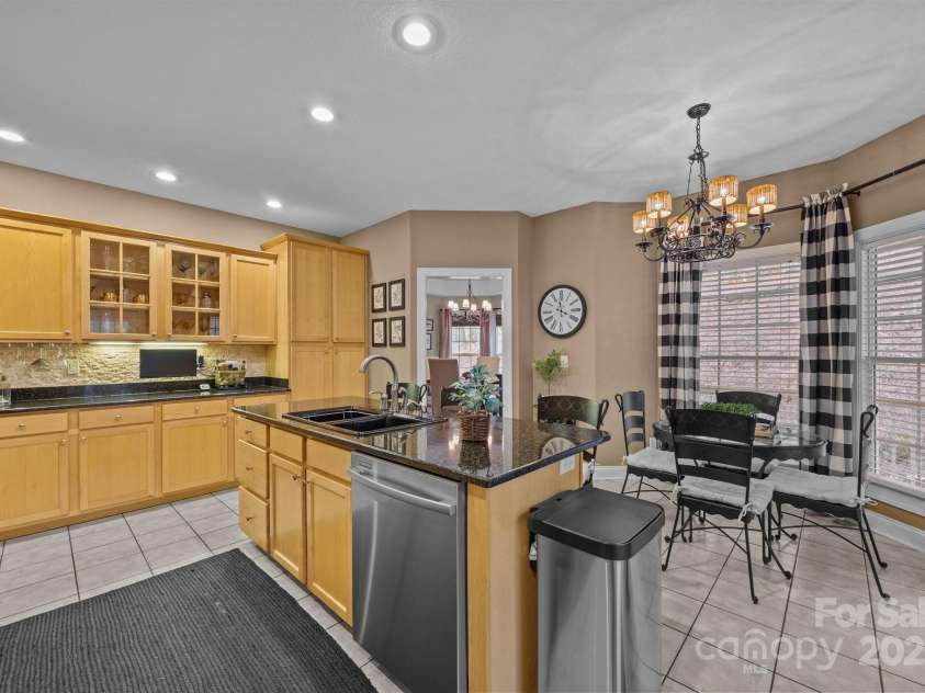 43 Smokemont Drive, Arden, NC 28704.  MLS# CAR4197497, YatesRealty ID 10921. View toward the kitchen dining space and entry into the dining room.