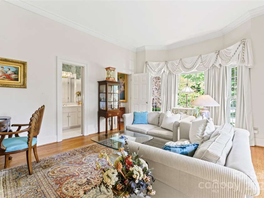 8934 Winged Bourne Drive, Charlotte, NC 28210.  MLS# CAR4245906, YatesRealty ID 10929. Lower level bedroom with ensuite bath, used here as a private den.