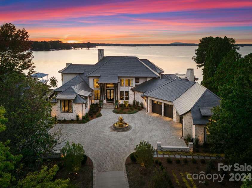 19125 Peninsula Point Drive, Cornelius, NC 28031.  MLS# CAR4180906, YatesRealty ID 1093. Endless views of Lake Norman set the backdrop for this exquisite home.