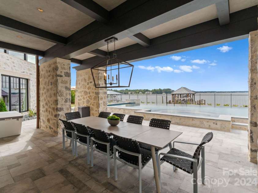 19125 Peninsula Point Drive, Cornelius, NC 28031.  MLS# CAR4180906, YatesRealty ID 1093. Lake-level covered patio.
