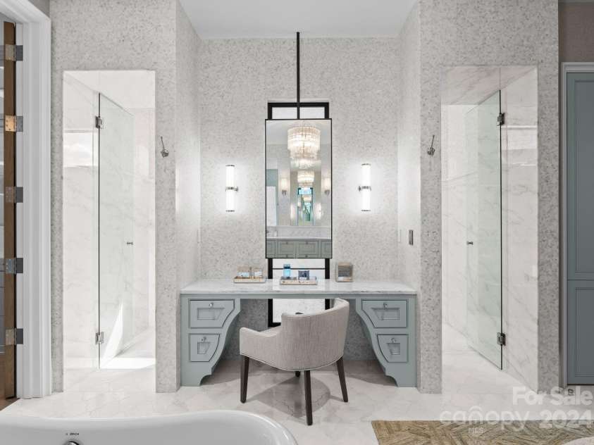 19125 Peninsula Point Drive, Cornelius, NC 28031.  MLS# CAR4180906, YatesRealty ID 1093. Walls are adorned with gorgeous wallpaper, custom made vanity with a unique cabinet design, framed by two glass door entries to the massive walk-thru shower.