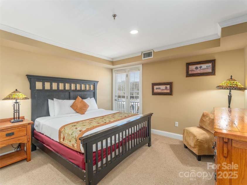330 Bowling Park Road, Asheville, NC 28803.  MLS# CAR4217187, YatesRealty ID 10931. Large bedroom with Juliet balcony, doors open