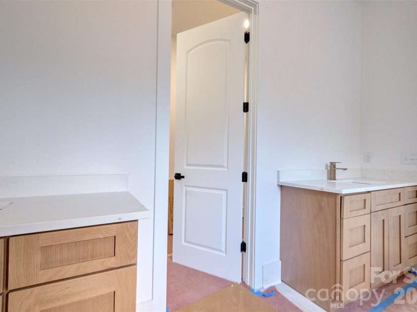 5104 Lowie Lane, Gastonia, NC 28056.  MLS# CAR4327132, YatesRealty ID 10932. His & hers vanities in master bathroom