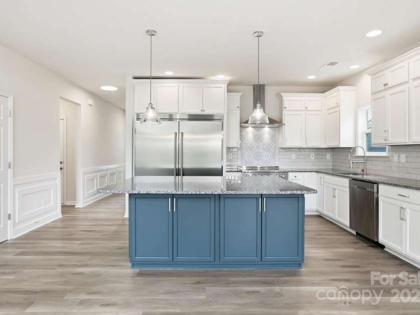 17909 Wilbanks Drive, Charlotte, NC 28278.  MLS# CAR4310693, YatesRealty ID 1094. Engage your inner chef in the Gourmet Kitchen, which boasts sleek stainless steel appliances, a center island, granite counters, and a spacious dining area