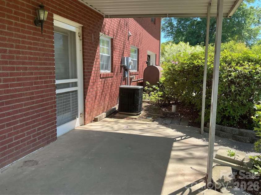 219 Central Avenue, Locust, NC 28097.  MLS# CAR4368249, YatesRealty ID 10940. Back patio